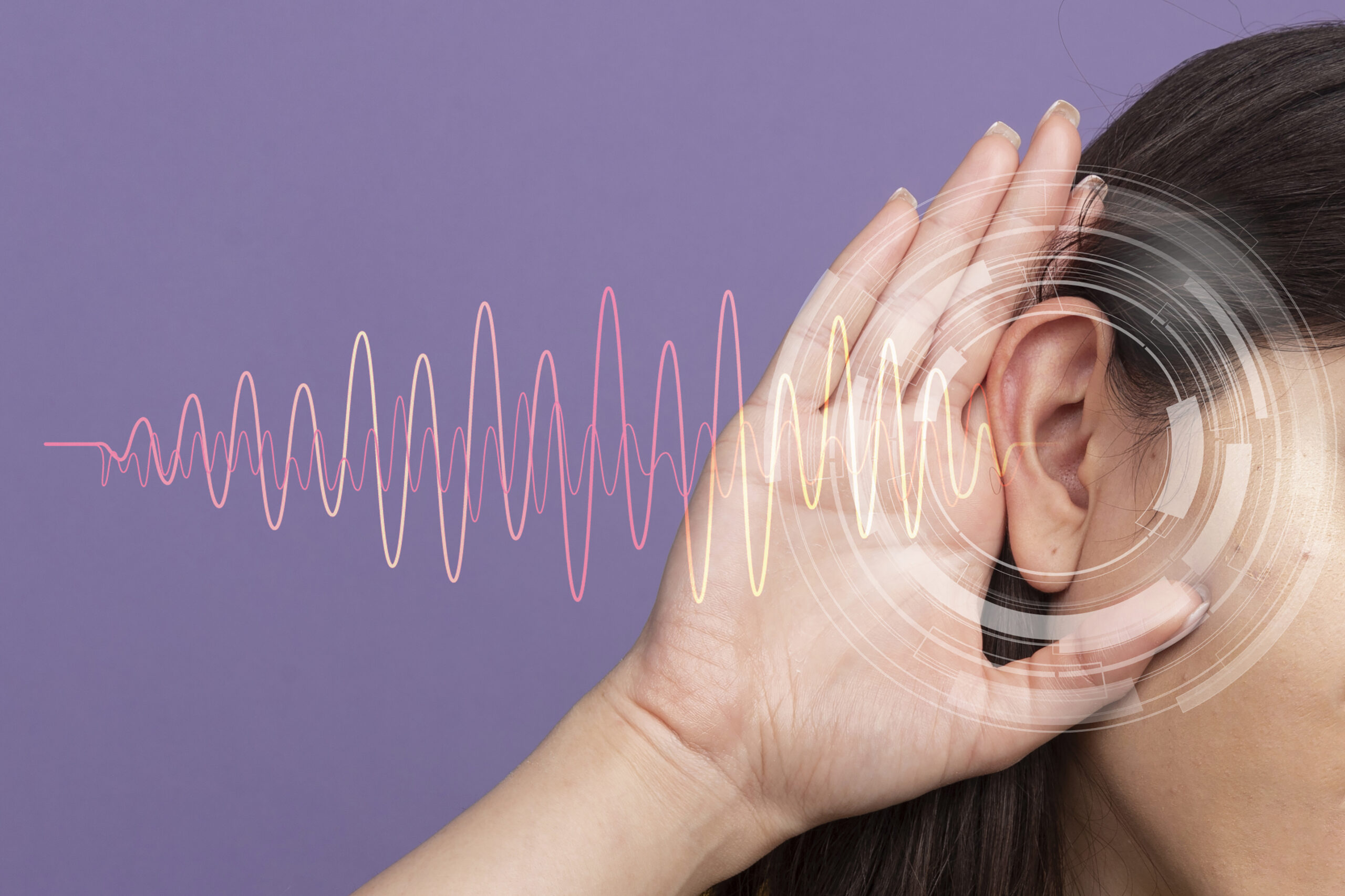curious young pretty caucasian girl looking at camera keeping hand behind ear doing i can't hear you gesture isolated on purple background